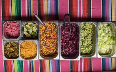 All the topping options for the tacos, nachos and burrito bowls