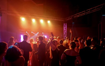 Pop-up nightclub, including DJ equipment, overhead club lighting, and large sound system