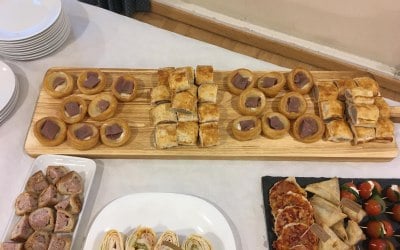 sausage roll, Yorkshire pudding with beef & horseradish on paddle board
