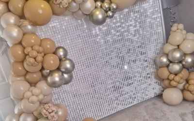 White sequin wall with balloon garland