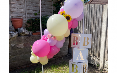 Balloon Garland on a Arch (2m x 1m)  with roses, sunflowers and baby boxes - From £105