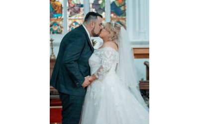 Bride and Groom in their first kiss as husband and wife. 