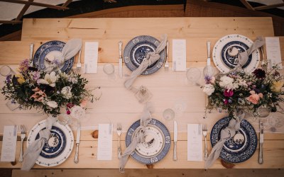Blue & white china, cut glass flutes & cutlery for a Yurt wedding