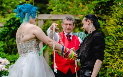 A traditional handfasting in the “Garden of Surprises.