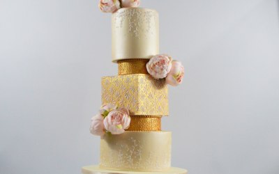 4 tier wedding cake decorated with peony flowers