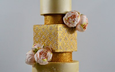 4 tier wedding cake decorated with peony flowers