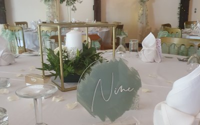 Gold centre piece floral stands and table numbers