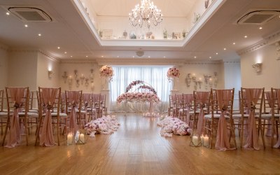 Blush pink wedding ceremony aisle and table styling