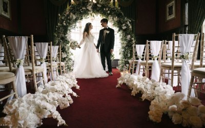 Wedding ceremony floral arch with foliage