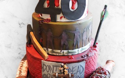 The walking dead 3 tiered cake with all hand made edible weapons