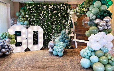 Luxury flower wall with our custom made selfie swing and our LED 4ft numbers. 