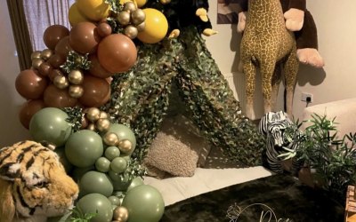 Jungle themed teepee tent and balloon decor