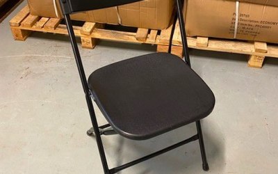 Black plastic folding chair