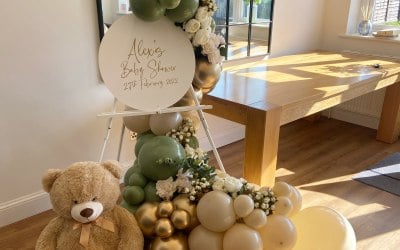 A baby shower balloon easel in the most on trend colours 