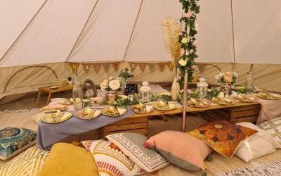 Low picnic dining in a 5m bell tent