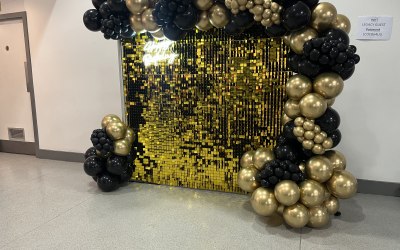 Sequin wall and balloons with neon 