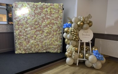Flower wall and easel for a baby shower 