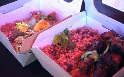 Rice and Peas served with Curry goat and jerk chicken 
