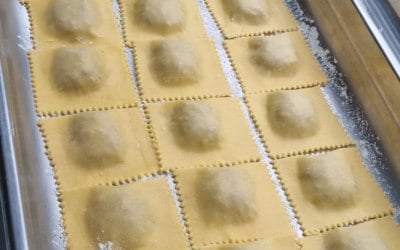Homemade ravioli filled with slow cooked lamb, apple and pine nuts