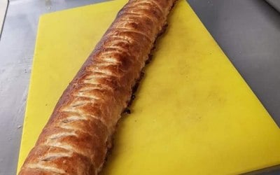 Fresh sausage roll with caramalised onions