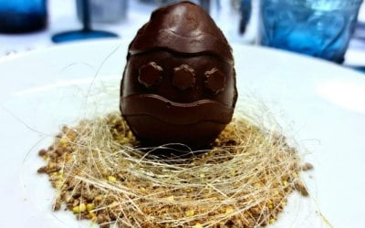 Chocolate easter egg on chocolate soil and a spun sugar nest