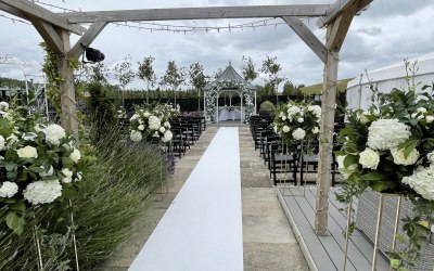 Outside ceremony florals