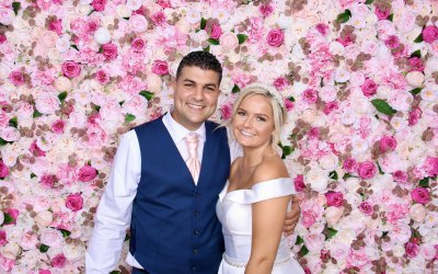 Wedding photo booth: flower wall, neon sign, boho chic, guest book, props
