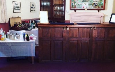 Albert our original dark wood vintage bar at Cambo Village Hall