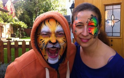 Donata's Face Painting - A tiger and a butterfly www.donatasfacepainting.co.uk