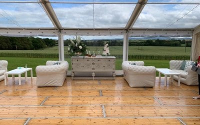 Marquee fitted with clear roofs and sides with gorgeous seating area