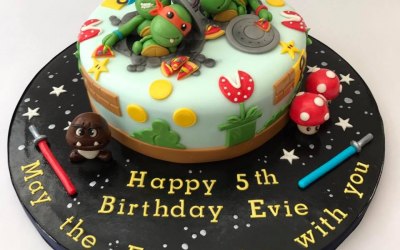 A fun mixed interest birthday cake for a little girl who couldnt choose between her love of Star Wars, Ninja Turtles or Super Mario!