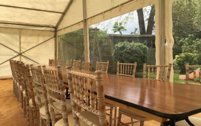 Unlined marquee ready for a dinner party