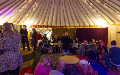 Our largest yurt. Decorated cosily. Groups of people enjoying the space.