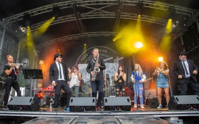 The 8-piece band at FeastyFest 2022, supporting Toploader.