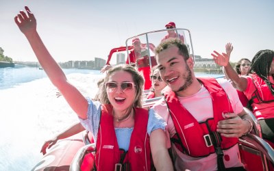 Experience a thrilling speedboat ride with friends 