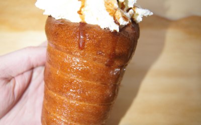 chimney cake cone with ice cream, whipped cream and flake bar