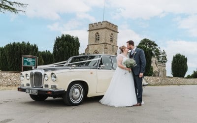 Bride and Groom infront of Little Gadsden Church, Tring with Lord Cars wedding transport