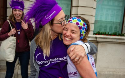 Family greeting a London Marathon Runner for Kidney Research UK