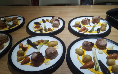 Pork fillet, roasted heritage carrots, roasted potatoes and leek, carrot pure 