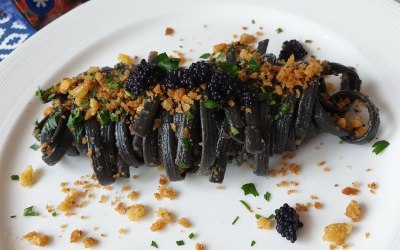 Squid ink pasta with breadcrumbs and caviar