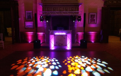 Wedding at Elmers Court Hotel & Resort, Lymington. 4 moving heads, 12 uplighters and 4 of my custom built glowshields used to light up the back wall, the wall on the opposite side of the dancefloor and the dancefloor.