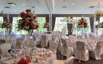 Venue Decor - 10ft blossom trees, centrepieces, chair covers and sashes.