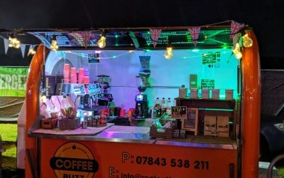 The Coffee Buzz Pod at night