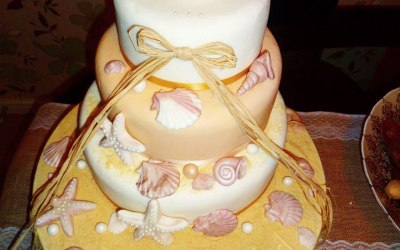 All Edible Wedding Cake (Except Haw Bow). Covered In Fondant. All Shells Made From Fondant, Sand Made From Tea Biscuit, Hay Bow Not Edible