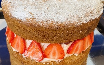 Victoria Sponge Cake filled with fresh cream and strawberries 