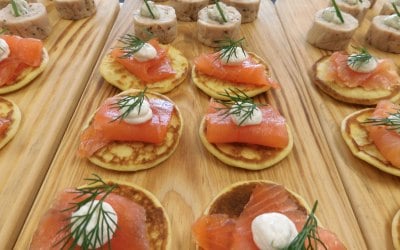 Our pre dinner canapés: smoked salmon blinis with lime cream cheese and dill, chicken terrine and tarragon emulsion