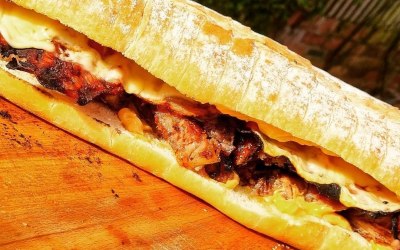 The cuban Pete - Slow cooked pork shoulder, grilled Italian ham, melted swiss cheese, spicy mayo on a toasted roll