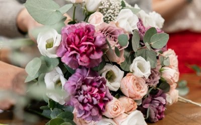 Arrange your own wedding flowers. Starting with a Hand Tied boquet that can be used for bridesmaids and the table decoration.