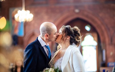 bride and groom first kiss