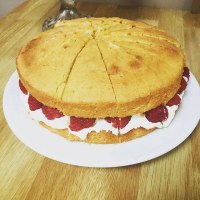 Classic Victoria sponge with fresh cream and strawberries The Pink Door Catering Co